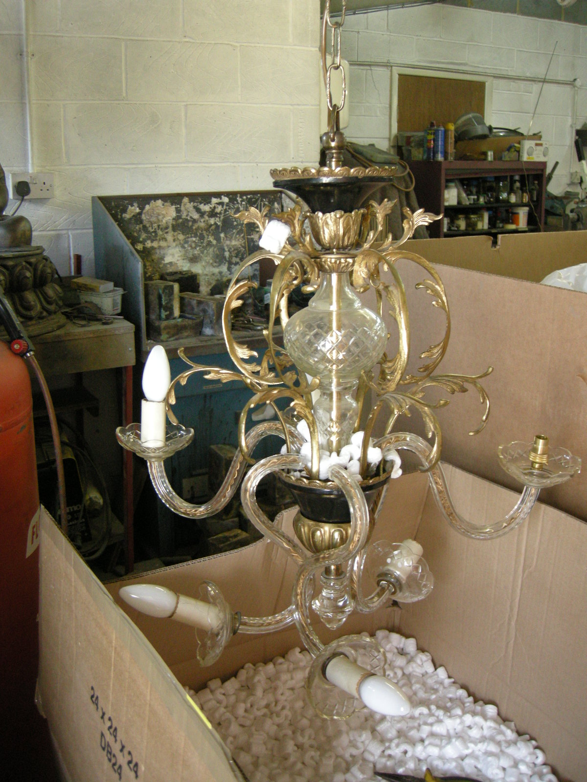 glass and brass chandelier before restoration